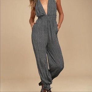 LULUs. Take a trip black print halter jump suit. GREAT condition!!!